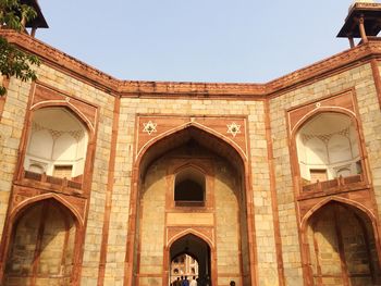 Low angle view of old building against clear sky