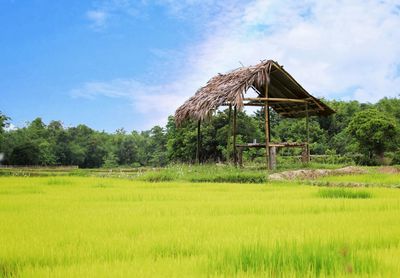 Built structure on field against sky