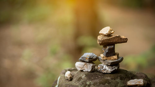 Close-up of rusty stack on rock