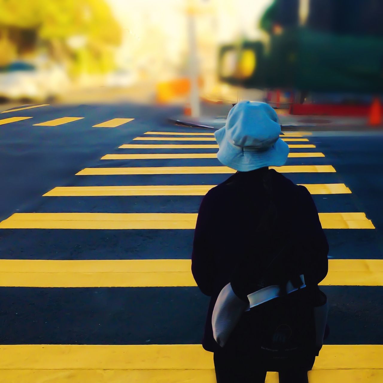 lifestyles, rear view, focus on foreground, men, street, leisure activity, casual clothing, standing, yellow, walking, city, transportation, city life, childhood, outdoors, three quarter length, selective focus