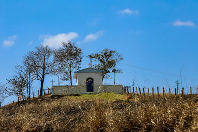 House on field against sky