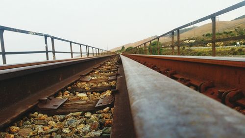 Railroad tracks against clear sky