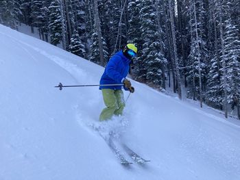 Man skiing on snow covered land