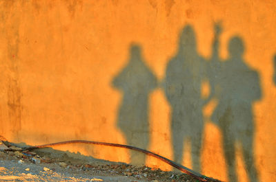 Shadow of people on wall