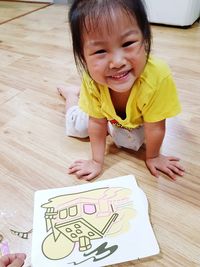 Portrait of a smiling girl on floor