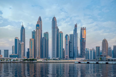 Amazing dubai marina and famous jumeirah beach at sunset, united arab emirates