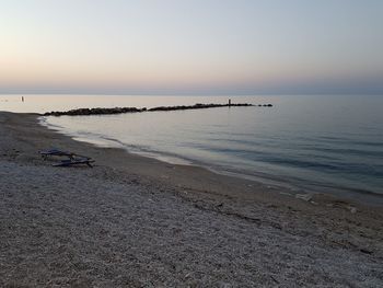 Scenic view of sea against clear sky during sunset