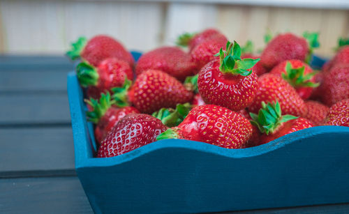 Close-up of strawberries in container on table