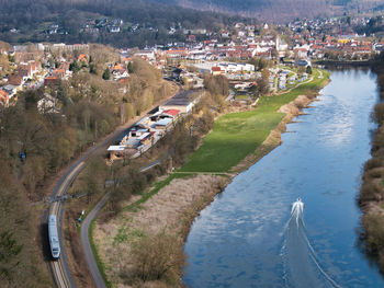 High angle view of river amidst buildings in town