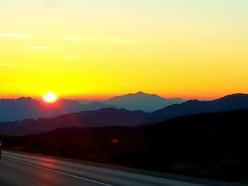 Scenic view of mountains against sky during sunset