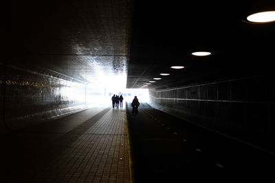 People walking in tunnel