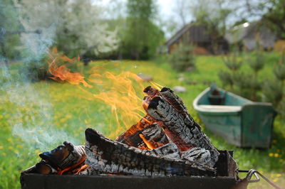 Burning fire pit on field