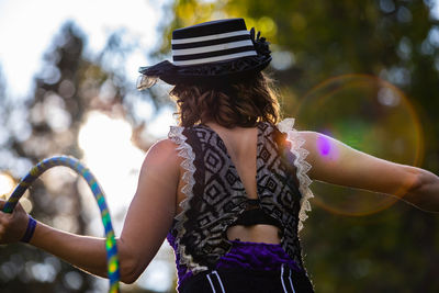 Rear view of woman wearing hat