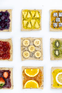 Directly above shot of food against white background