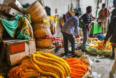 People working at market stall