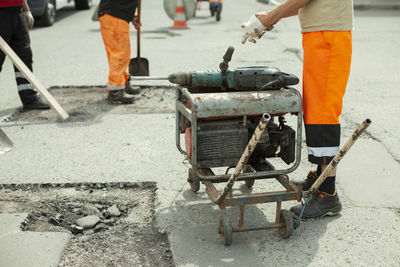 Low section of men working at construction site