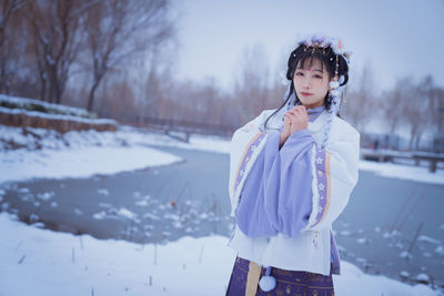A girl in hanfu in the snow