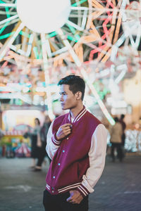 Man standing in amusement park