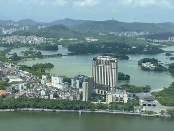 High angle view of river and buildings in city