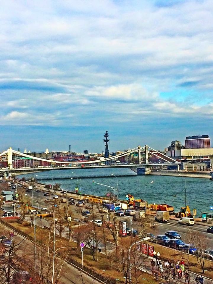 built structure, architecture, building exterior, sky, cloud - sky, water, harbor, commercial dock, city, sea, cloudy, nautical vessel, cloud, transportation, cityscape, crane - construction machinery, day, river, high angle view, industry