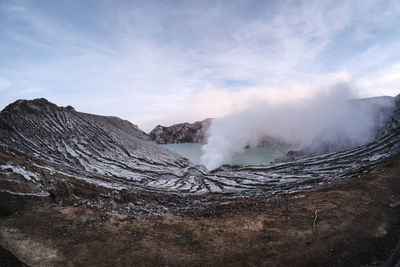 View of volcanic landscape against sky