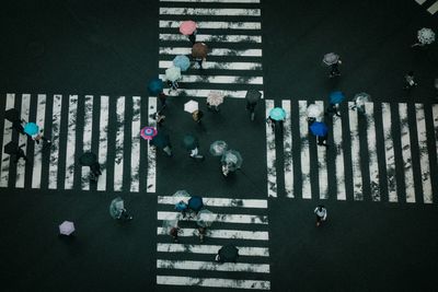 High angle view of people crossing road