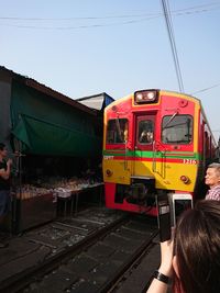 Train on railroad track against clear sky