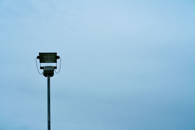 Low angle view of street light against clear blue sky