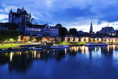 Reflection of illuminated buildings in water