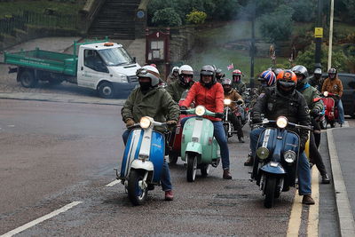 Rear view of people on road