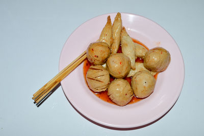 High angle view of eggs in plate on table