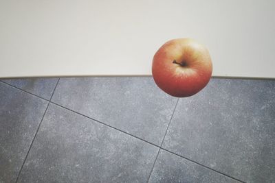 Red fruit on floor