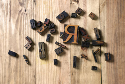 High angle view of text on wooden floor