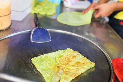 Close-up of person preparing food