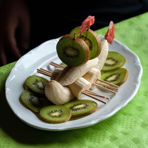 High angle view of fruits in plate on table