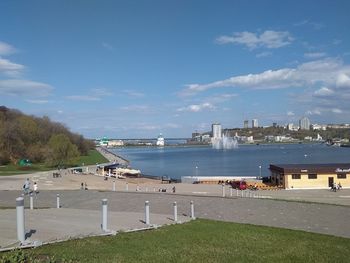 Scenic view of sea against buildings in city