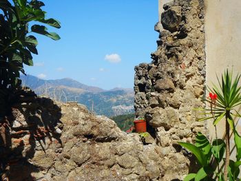 Scenic view of mountains against blue sky