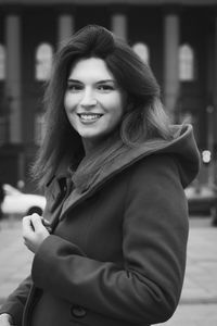 Close up elegant woman in coat on city street monochrome portrait picture