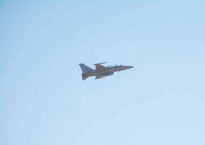 Low angle view of airplane flying in sky