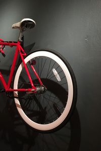 Close-up of bicycle wheel at night