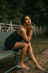 Young woman sitting on slide