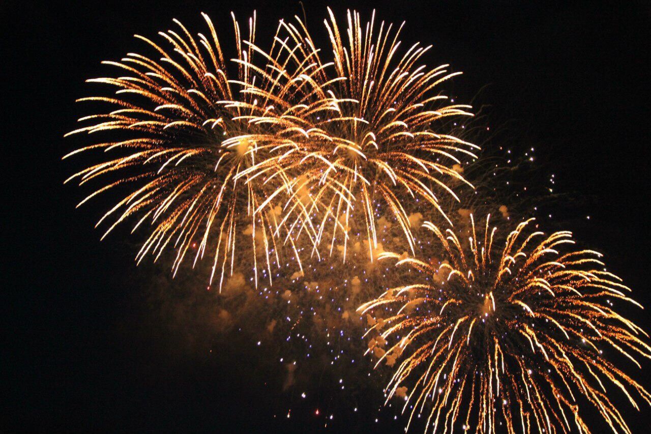 celebration, night, firework display, motion, long exposure, low angle view, exploding, arts culture and entertainment, illuminated, glowing, firework - man made object, sparks, event, sky, firework, outdoors, entertainment, multi colored, bright, celebration event, scenics