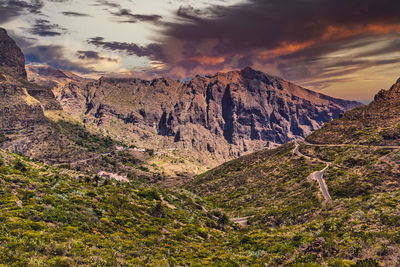 Scenic view of rocky mountains against sky during sunset