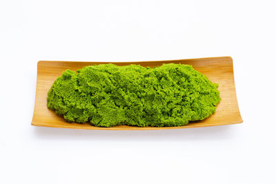 High angle view of vegetables on cutting board against white background