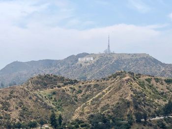 Scenic view of landscape and mountains against sky