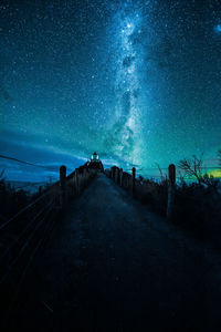 Bridge against star field at night