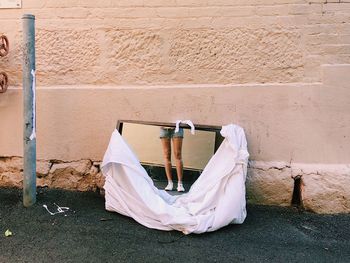 Reflection of woman standing outdoors