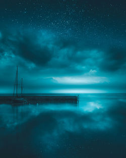 Scenic view of sea against sky at night