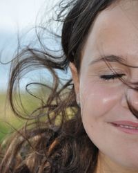 Close-up portrait of young woman with eyes closed
