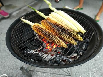 High angle view of corn on barbecue grill